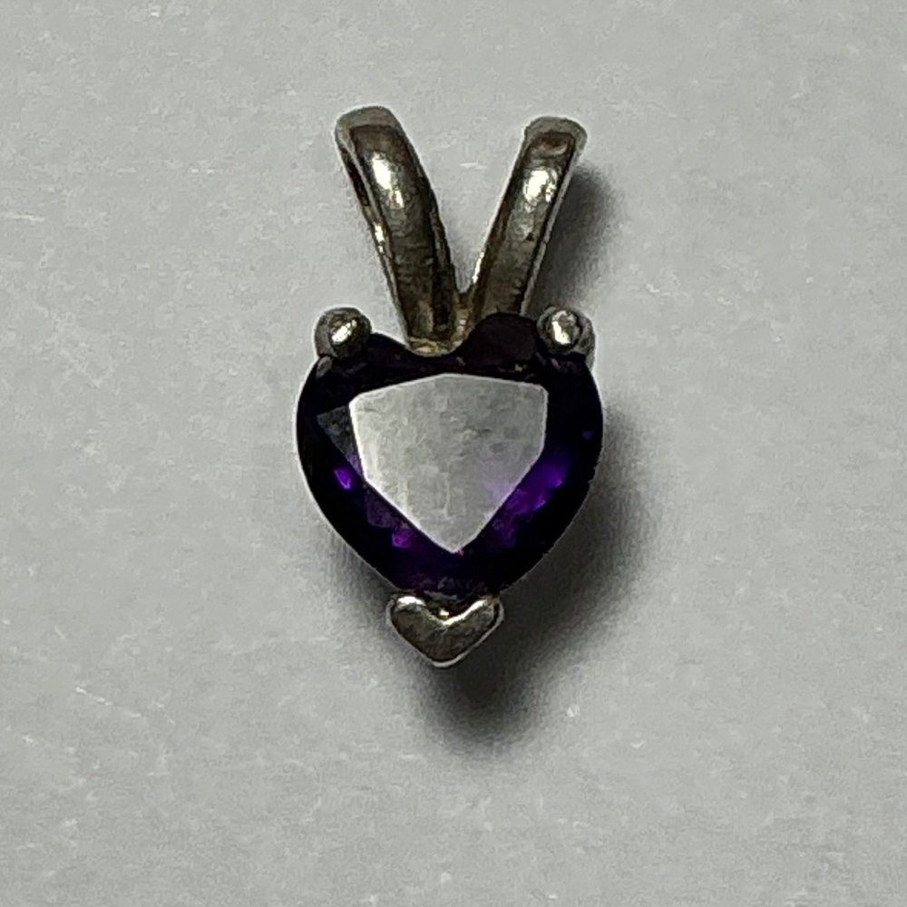 Sterling Silver Heart Shaped Pendant with an Amethyst Stone. 1/2 inch long